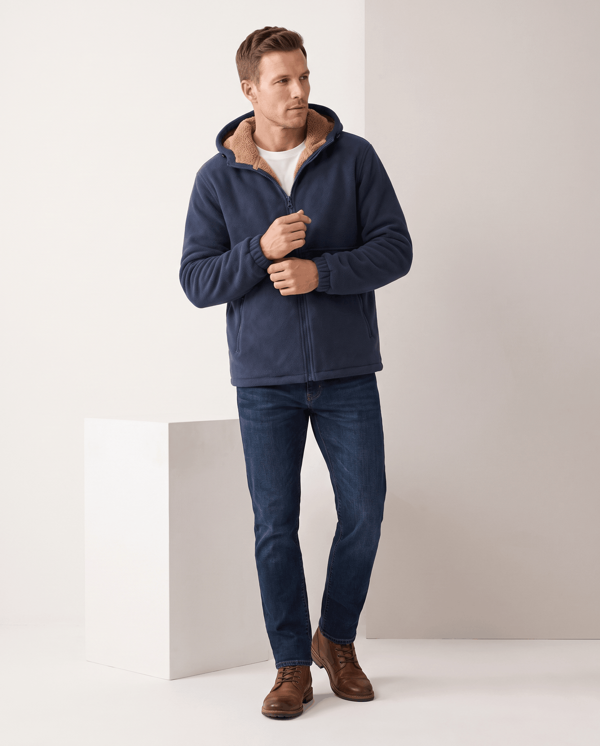 Full-length look with the navy hoodie, dark jeans and brown leather boots