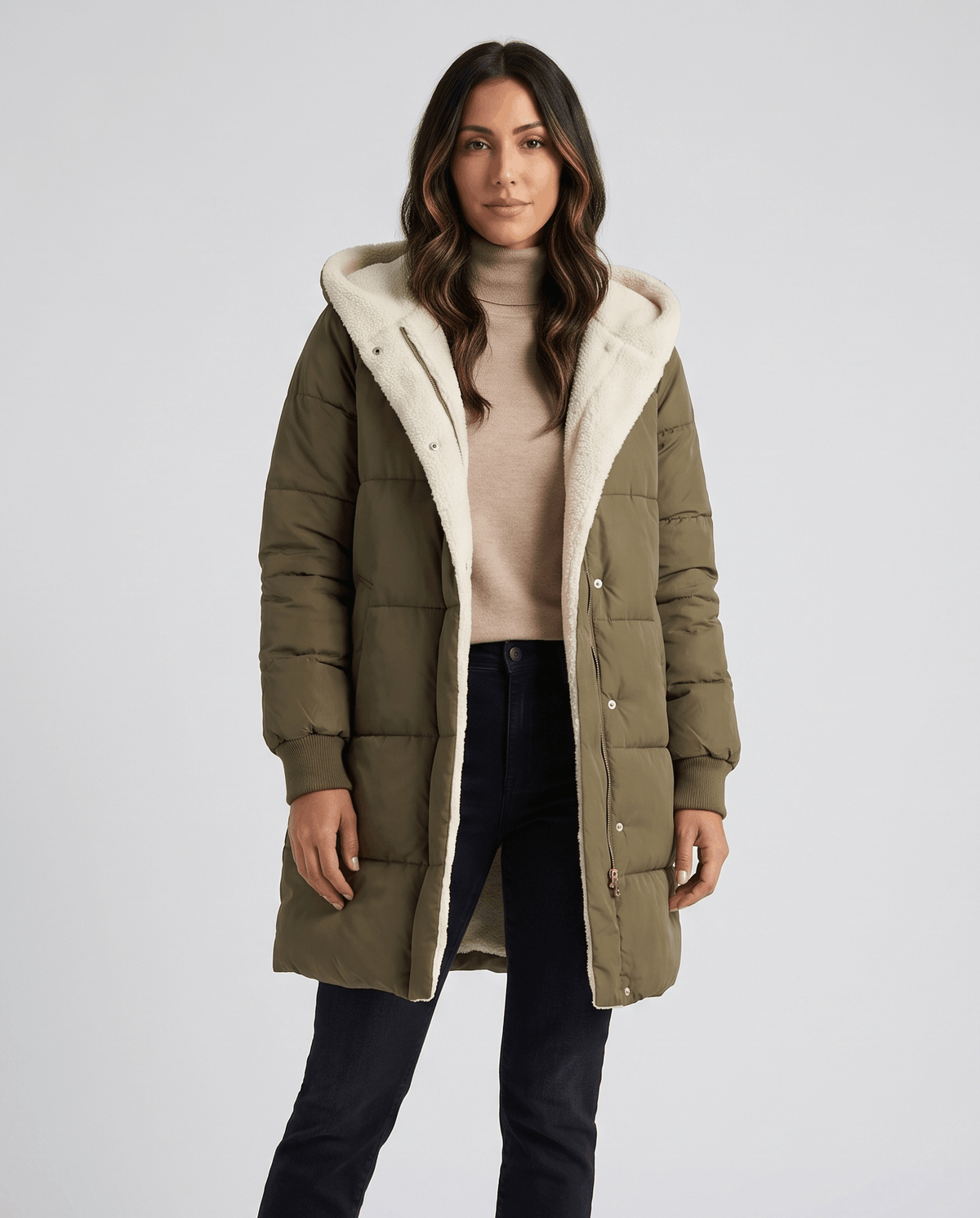 Woman in army green sherpa-lined puffer coat over a beige top
