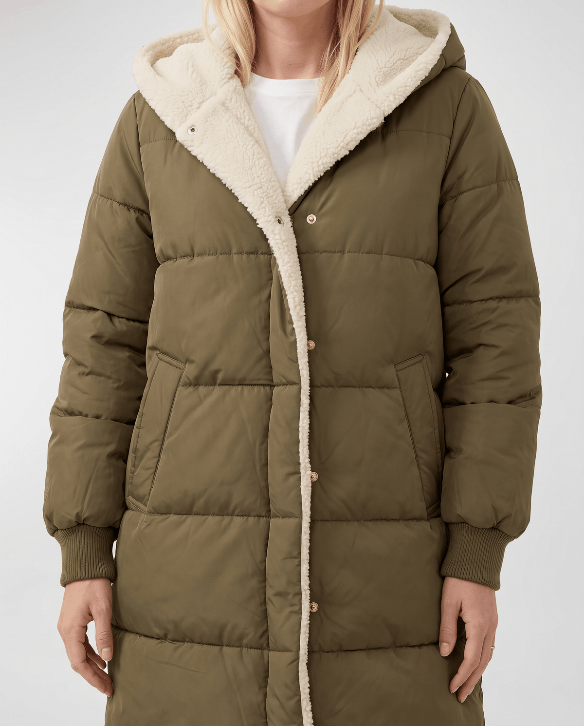 Army green coat worn open showing sherpa facing and ribbed cuffs