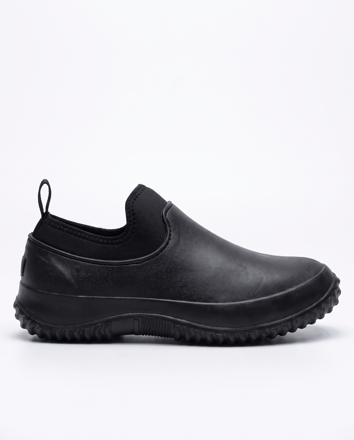 Side view of a single black shoe with stretch collar and tread sole