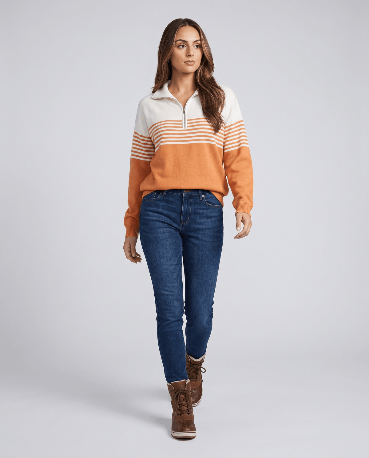 Full-length view of orange two-tone pullover with jeans and brown ankle boots