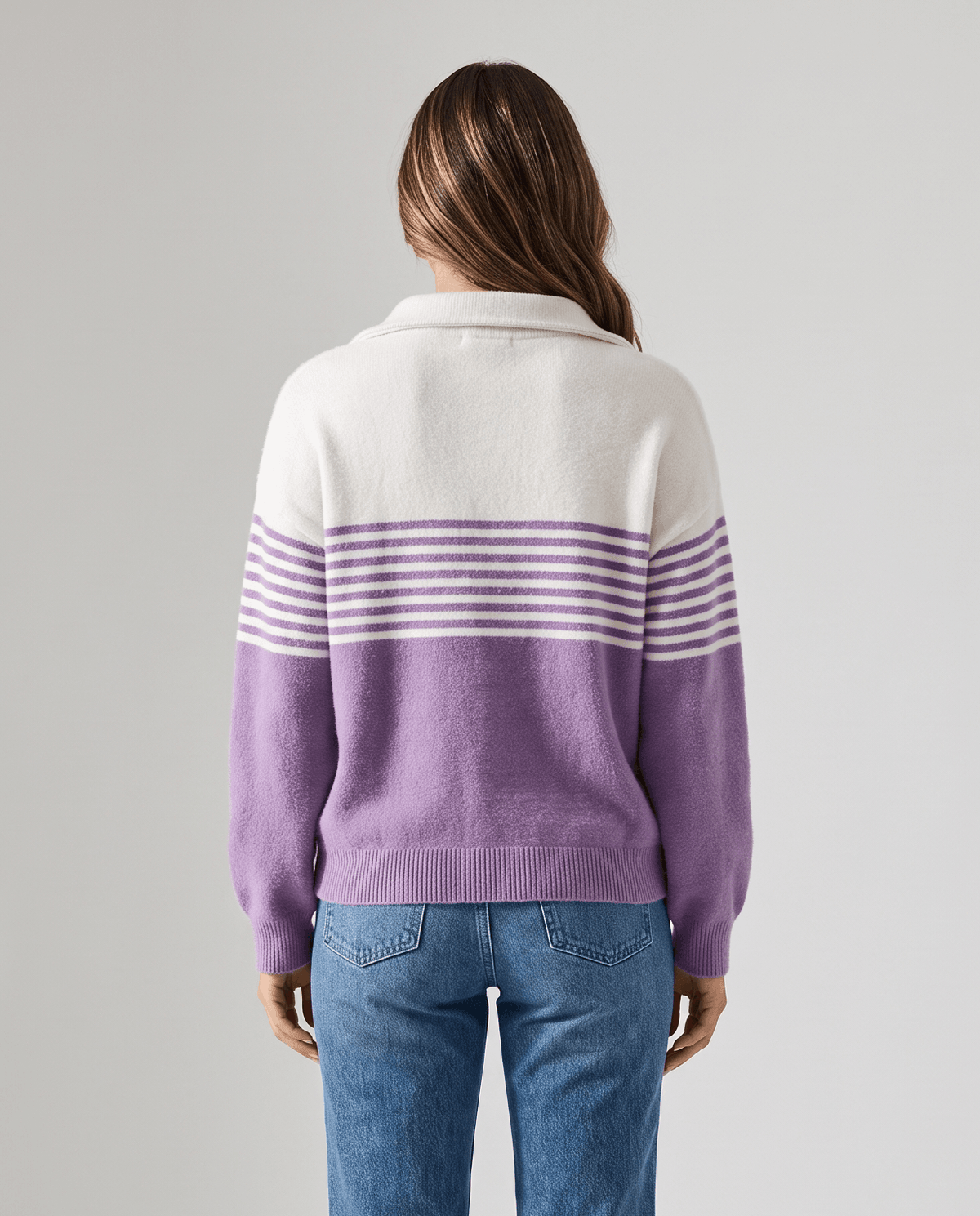 Back view of purple and ivory striped pullover showing relaxed fit and long sleeves
