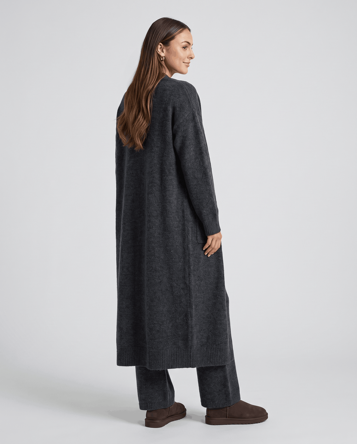 Back view of the dark gray long cardigan coat with wide-leg pants
