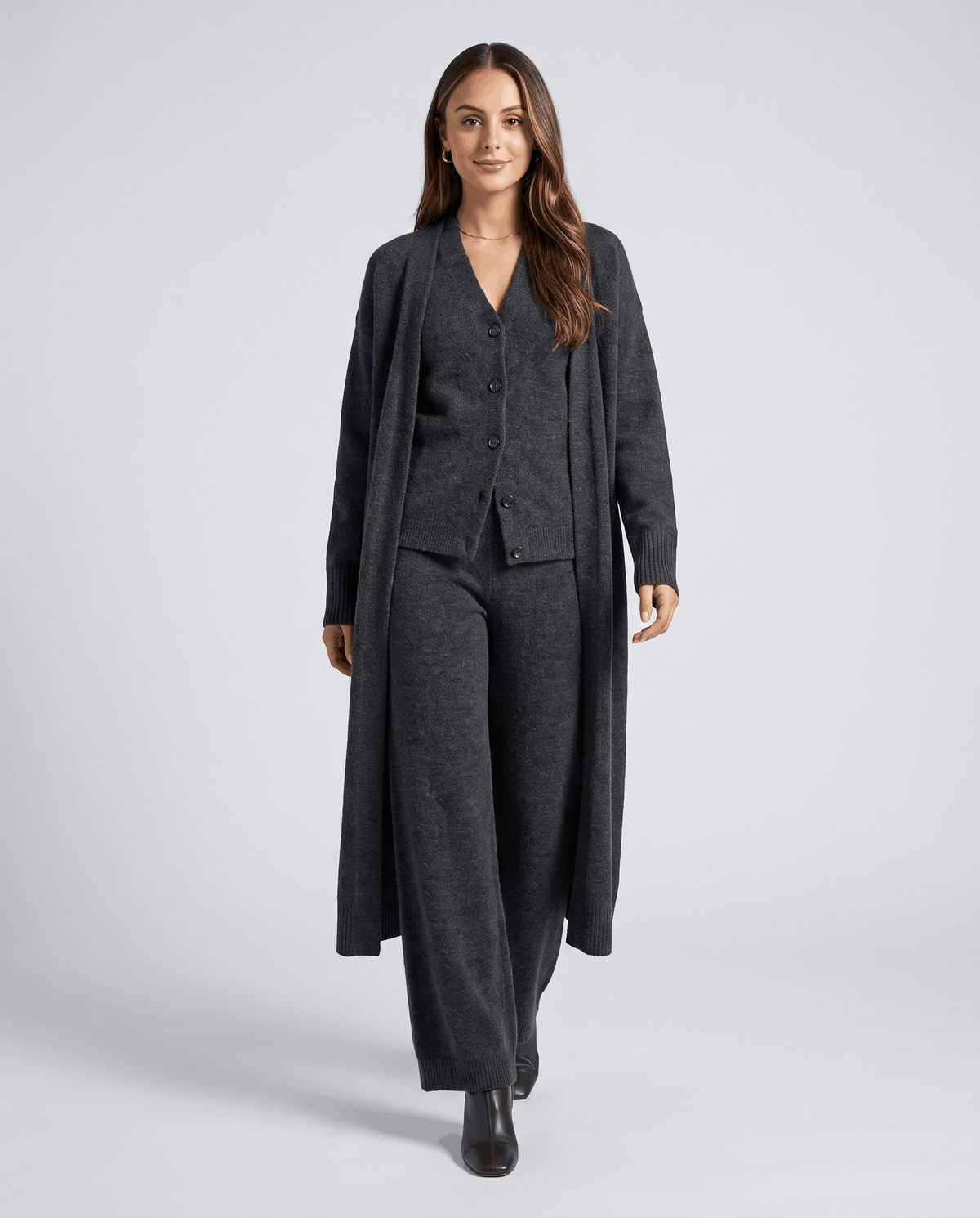 Dark gray long cardigan coat, knit vest and wide-leg pants, full-length front view