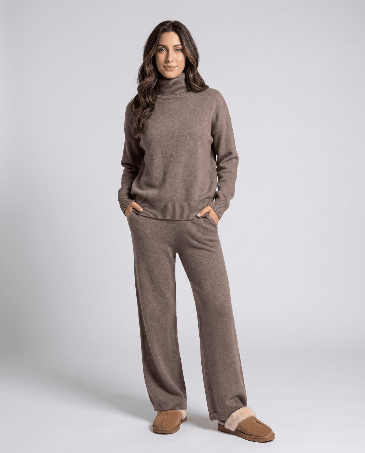 Woman in taupe turtleneck lounge set with straight-leg pants and slippers, front view