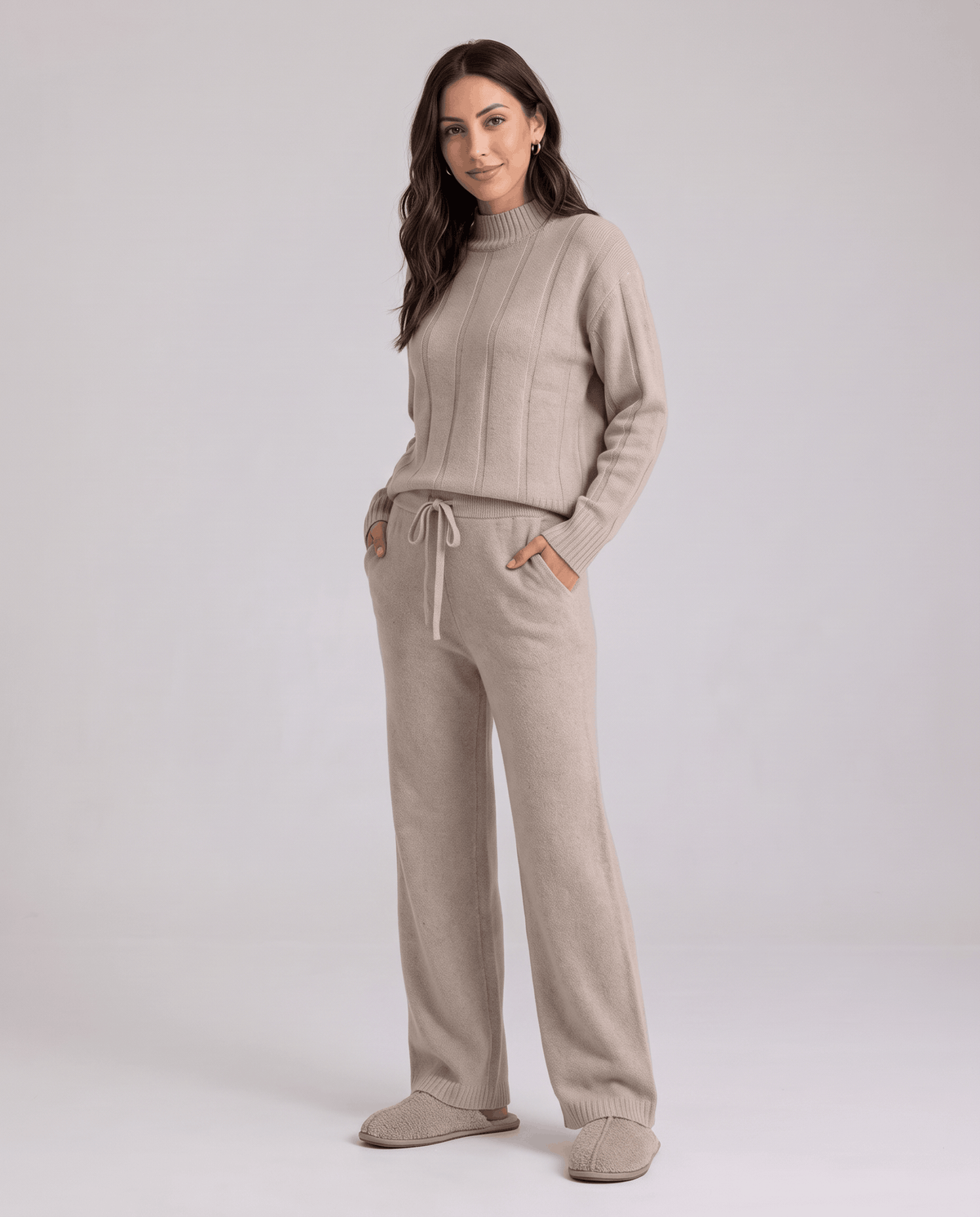 Woman in beige wide-leg lounge set with ribbed knit top and drawstring pants, front view