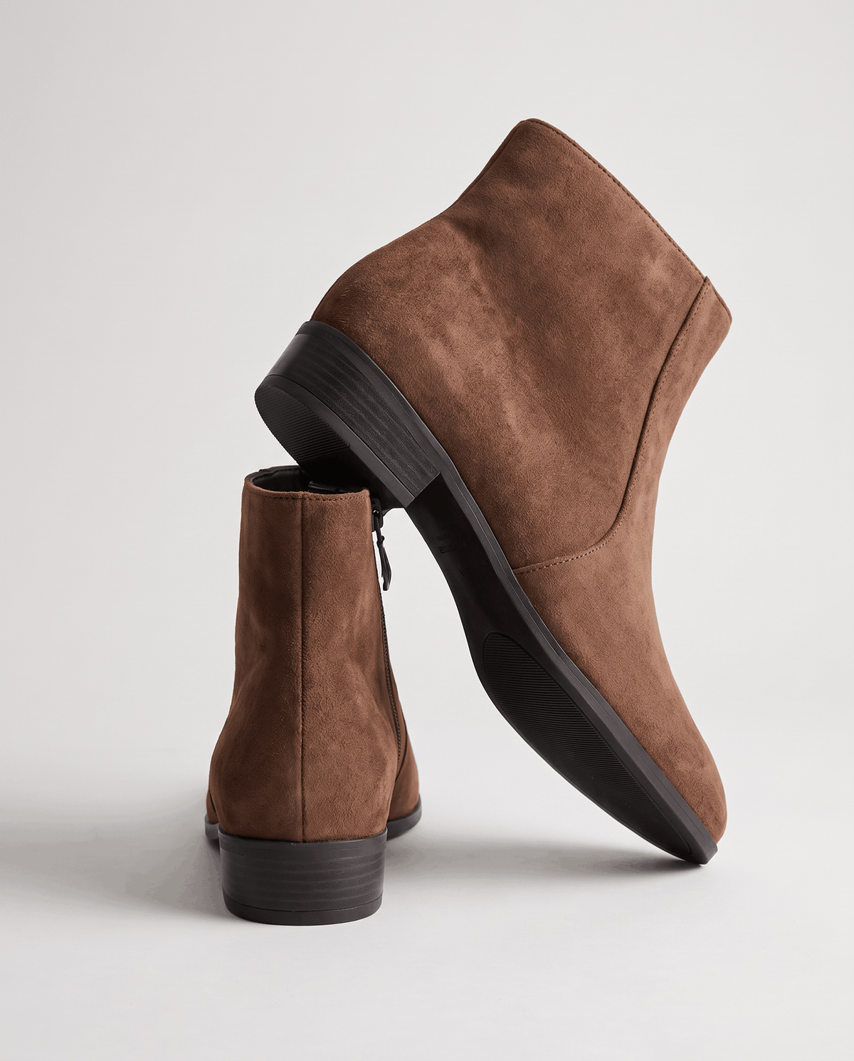 Brown suede-look ankle boot angled to show the low block heel