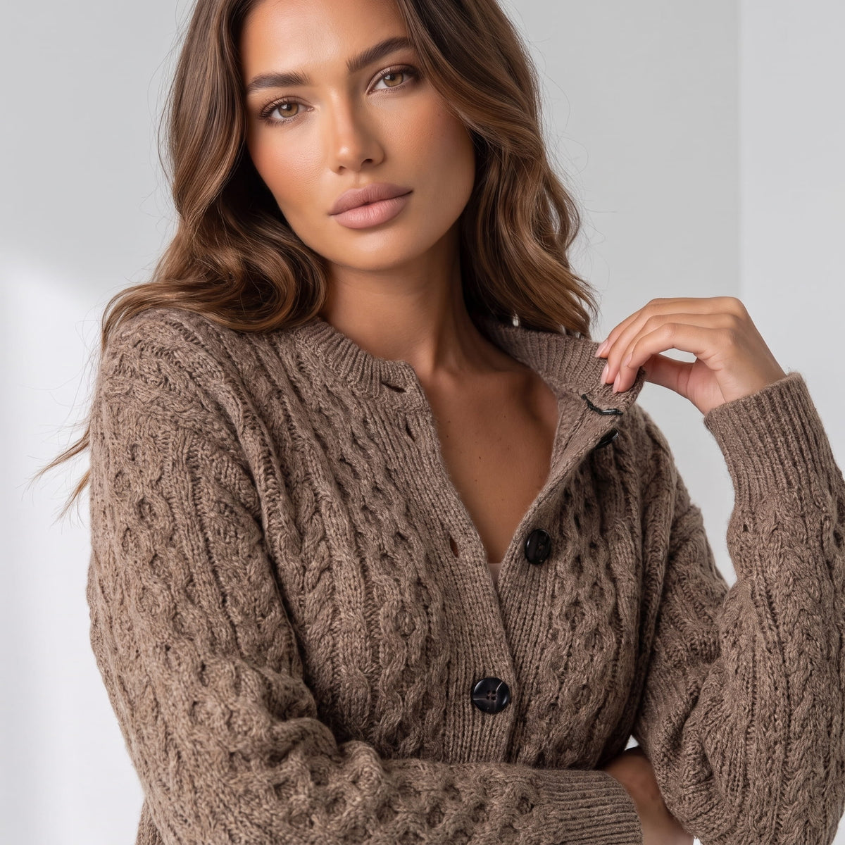 Camel cable-knit cardigan buttons and cable pattern shown in close view