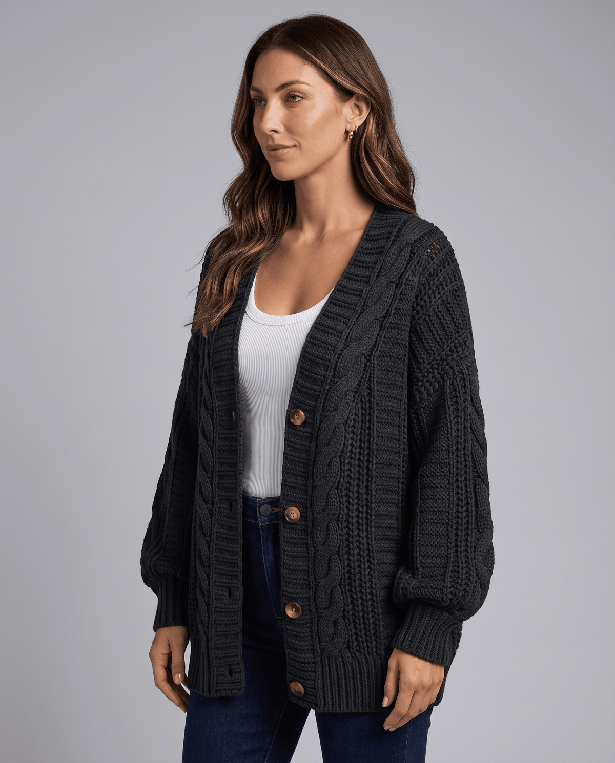Three-quarter view of a charcoal cardigan with a deep V neck and buttons