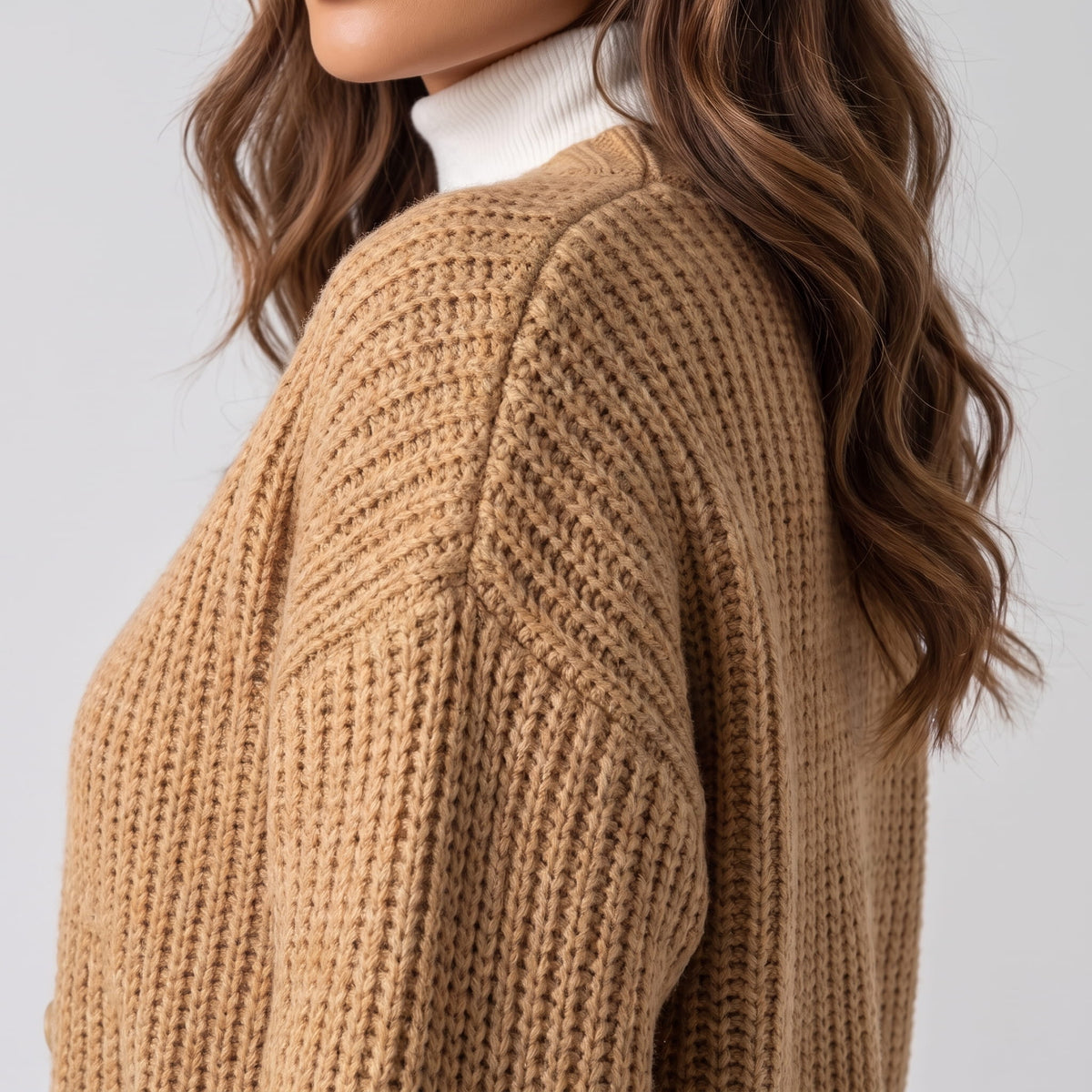 Close side view of khaki chunky ribbed knit cardigan and balloon sleeve