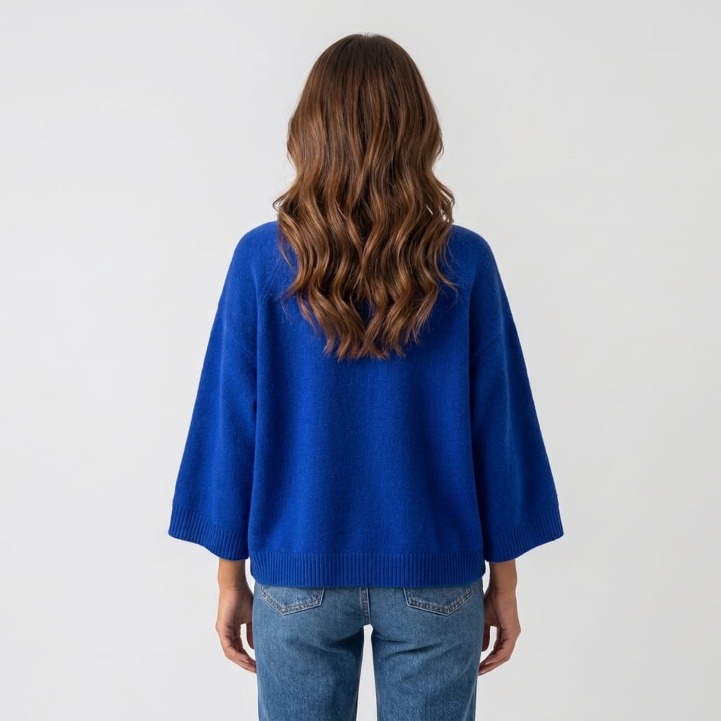 Back view of blue boxy sweater with wide three-quarter sleeves