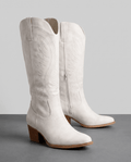 Pair of white embroidered western boots with pointed toes, inside zip and stacked heels