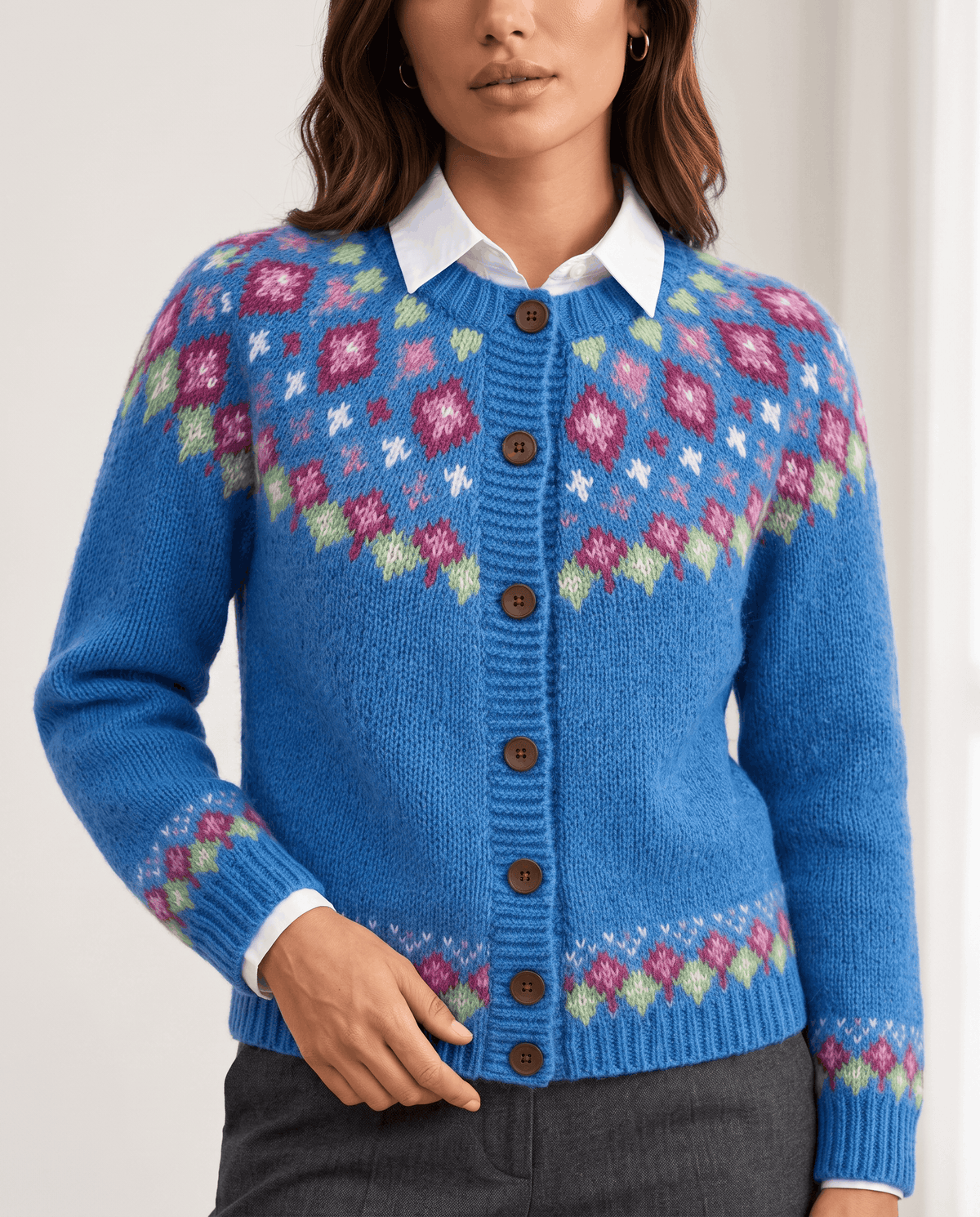 Close-up of blue Fair Isle yoke pattern with white collar and buttons
