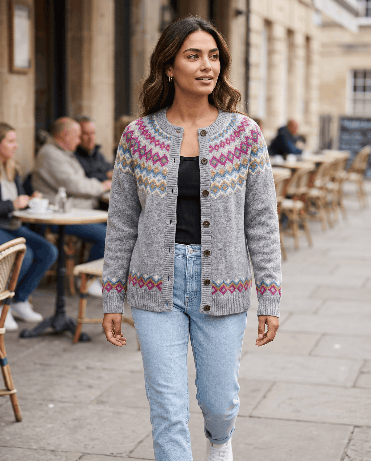 Gray Fair Isle cardigan styled with light jeans on a sunny street
