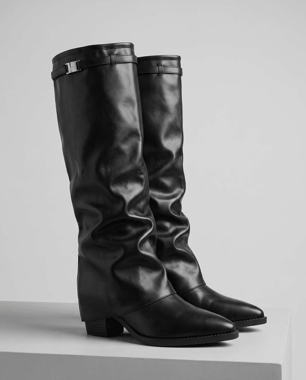 Black pair on a white display block with silver buckle cuffs
