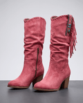 Pair of red fringe cowboy boots with slouchy shafts, concho straps and stacked heels