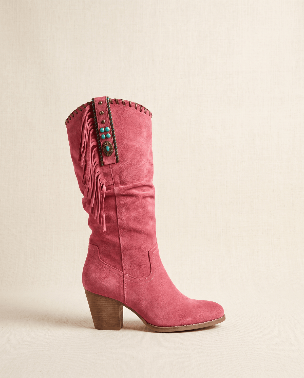 Single red boot in side profile showing turquoise-bead strap and whipstitched trim