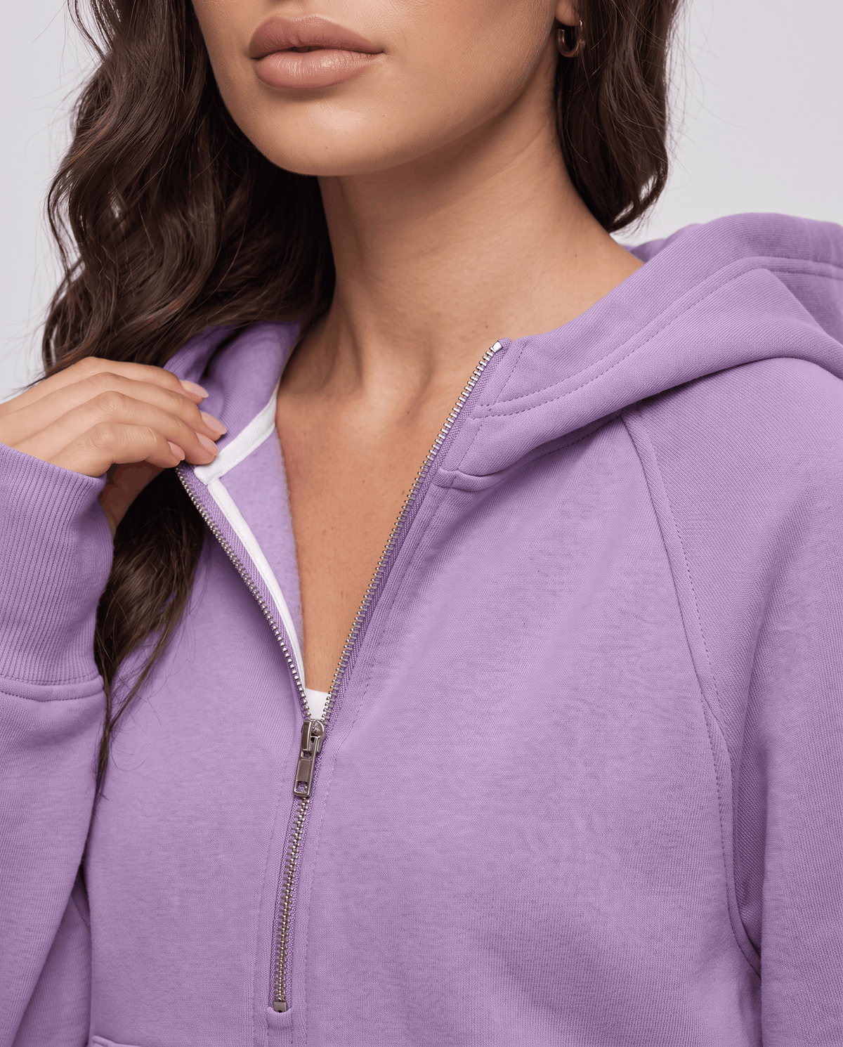 Close-up of the purple hoodie half zip front and hood in textured fleece