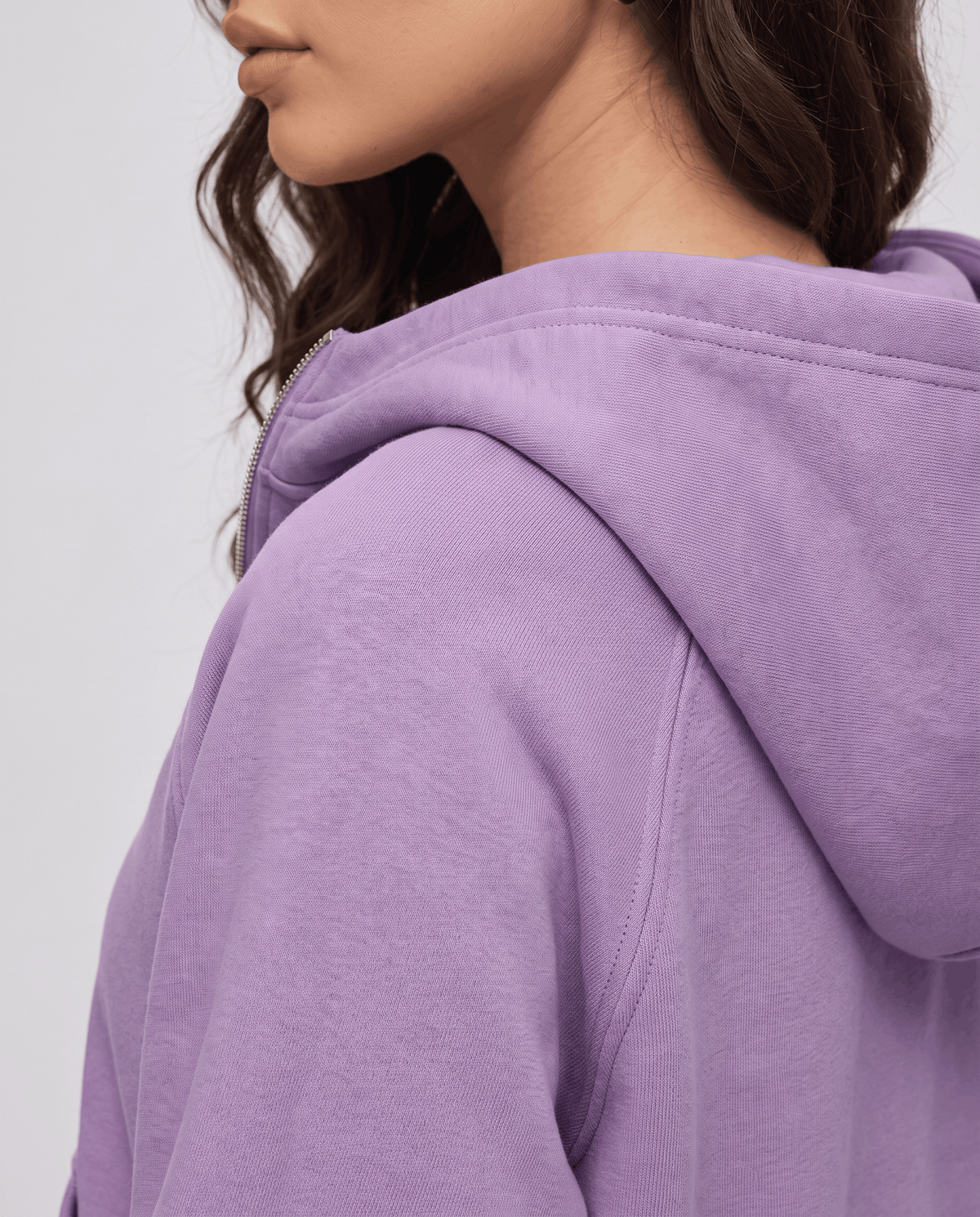 Side view of the purple hood and sleeve showing the soft brushed fleece fabric