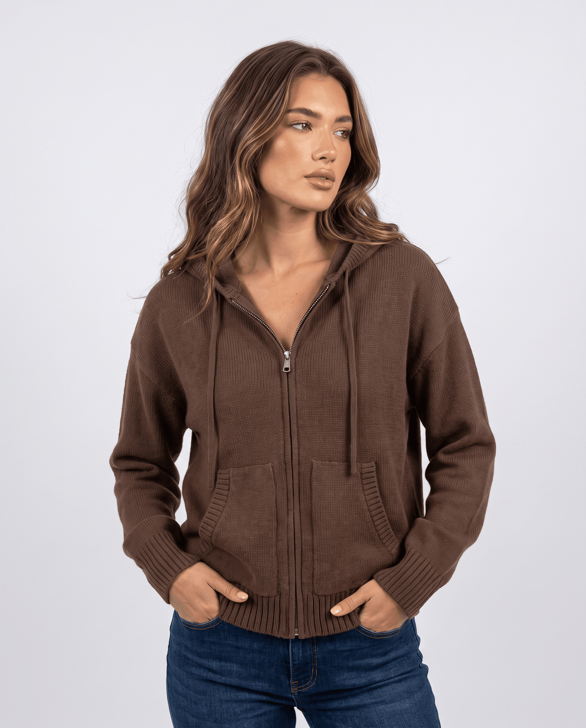 Women's hooded knit cardigan in dark brown with a zip front and hands in pockets