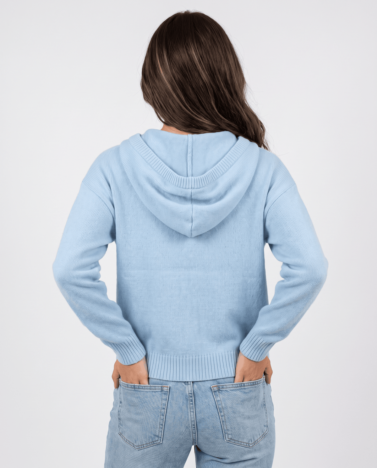 Back of sky blue knit cardigan with the hood down and a relaxed oversized fit
