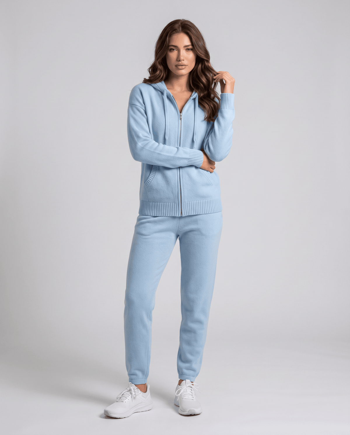 Full-length sky blue cardigan styled with matching light blue joggers and sneakers