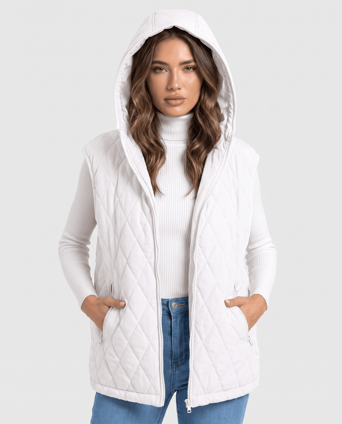 White hooded quilted vest with hood up and hands in front pockets