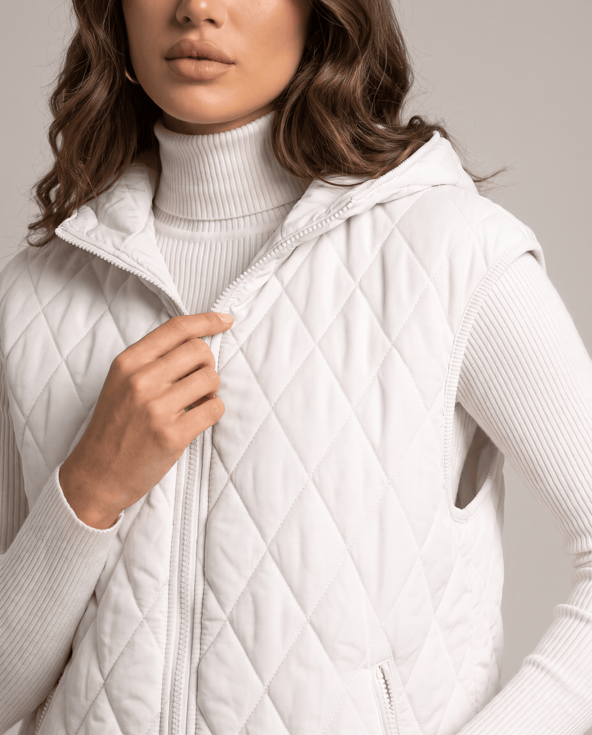 White diamond-quilted vest front zip and hood shown in close view