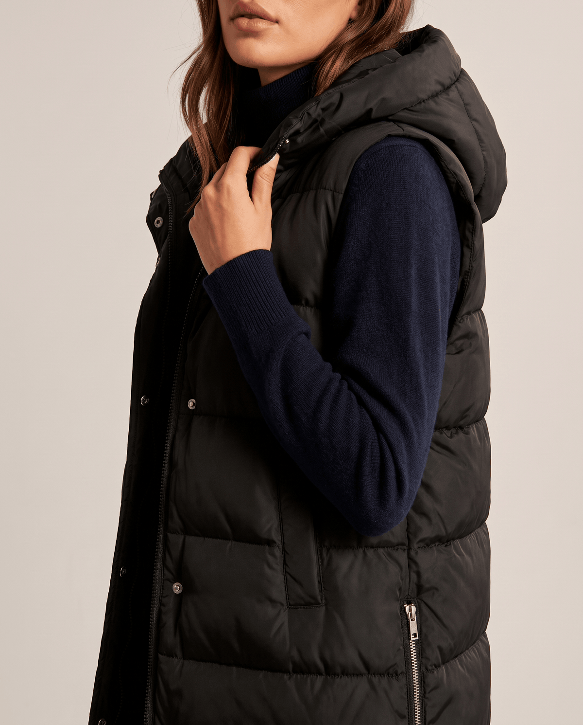 Black quilted vest hood and front placket shown in close view