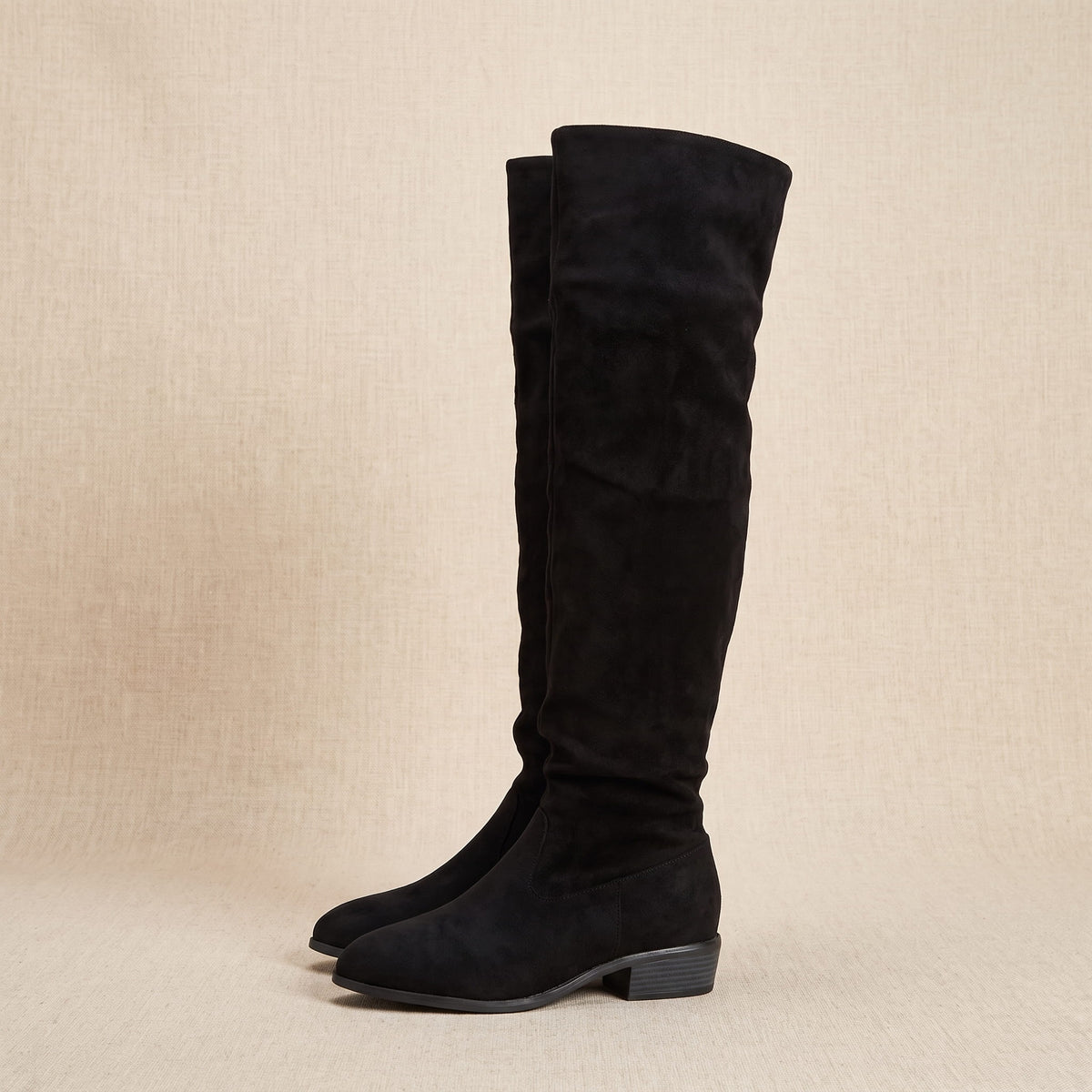 Single black boot in side profile showing the full tall shaft