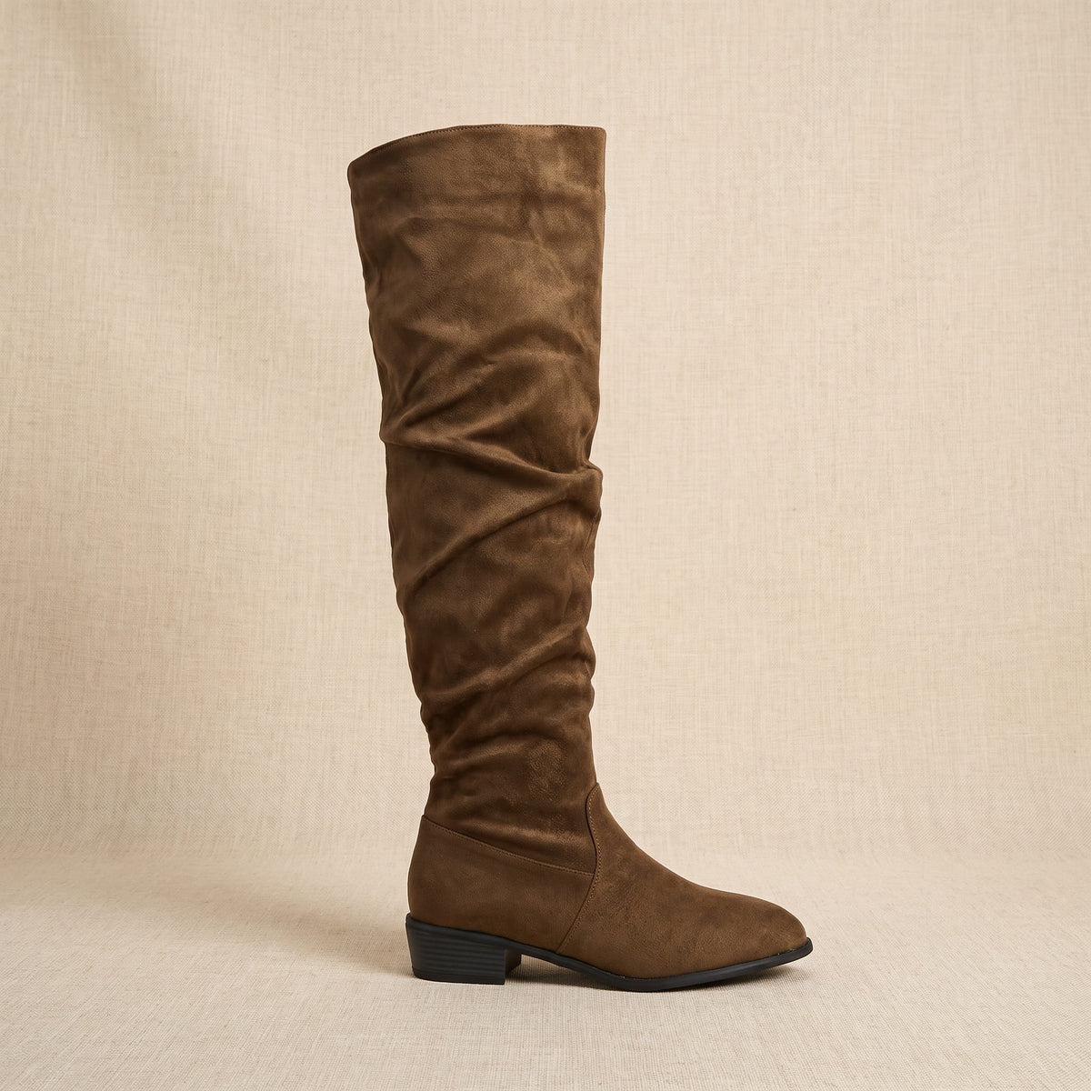 Single olive brown boot in side profile showing the slouched ankle