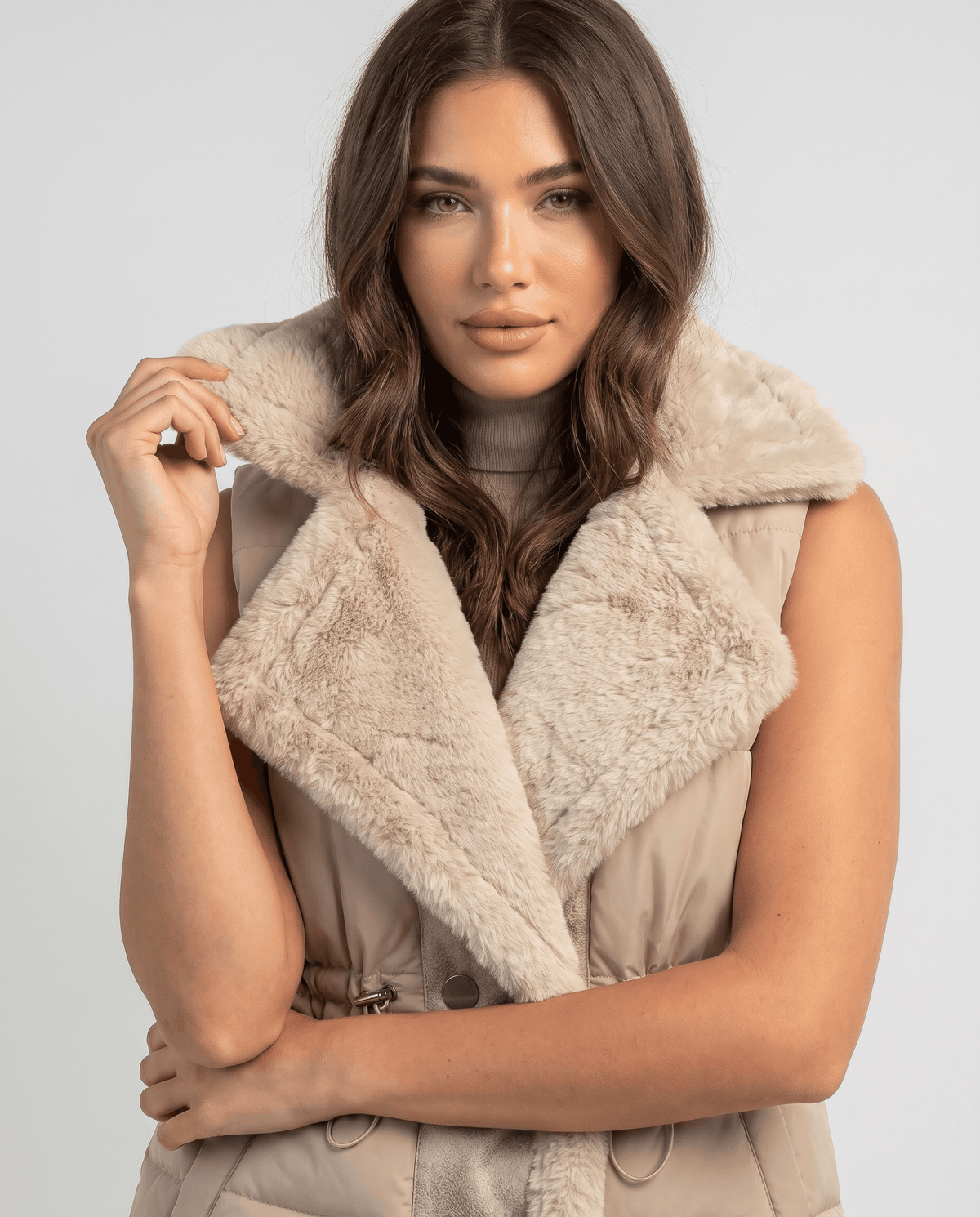 Brown padded vest plush collar and cinched waist shown in close view