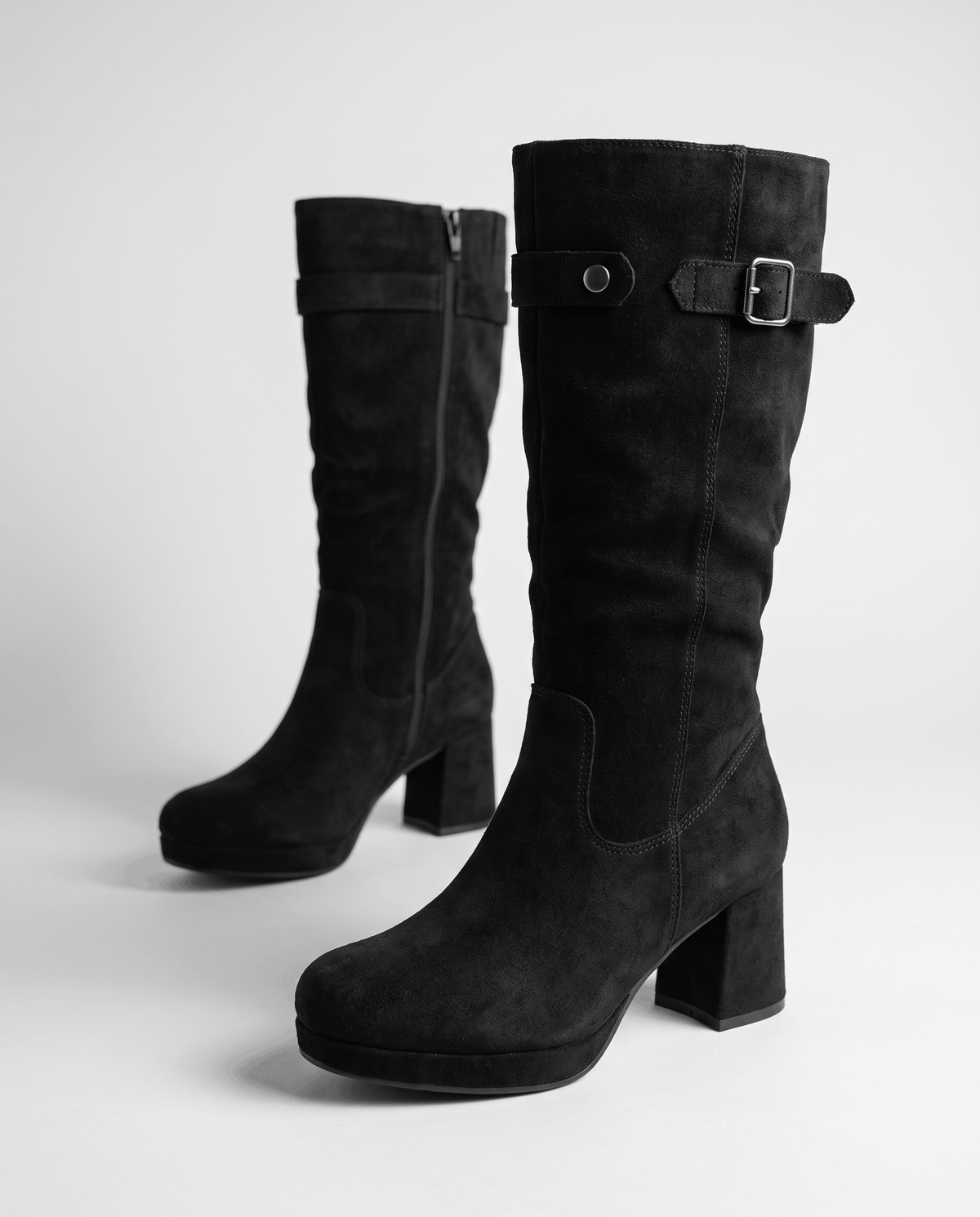 Black pair showing the inside zip, buckle strap and chunky block heel