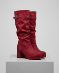 Platform mid-calf slouch boots in red vegan suede on a white display block