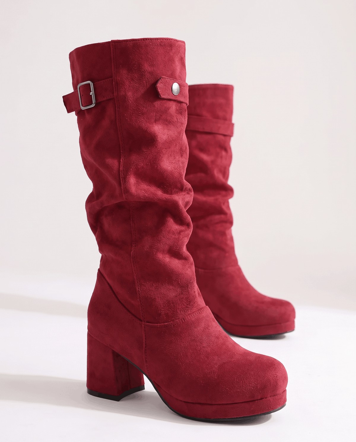 Red pair angled to show the chunky block heel and buckle strap cuff