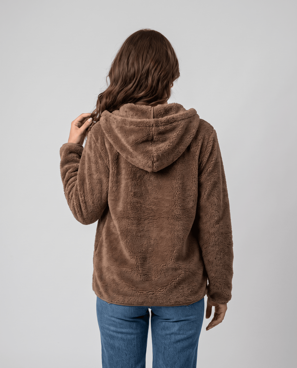 Back of brown sherpa hoodie with the hood down and a relaxed oversized fit