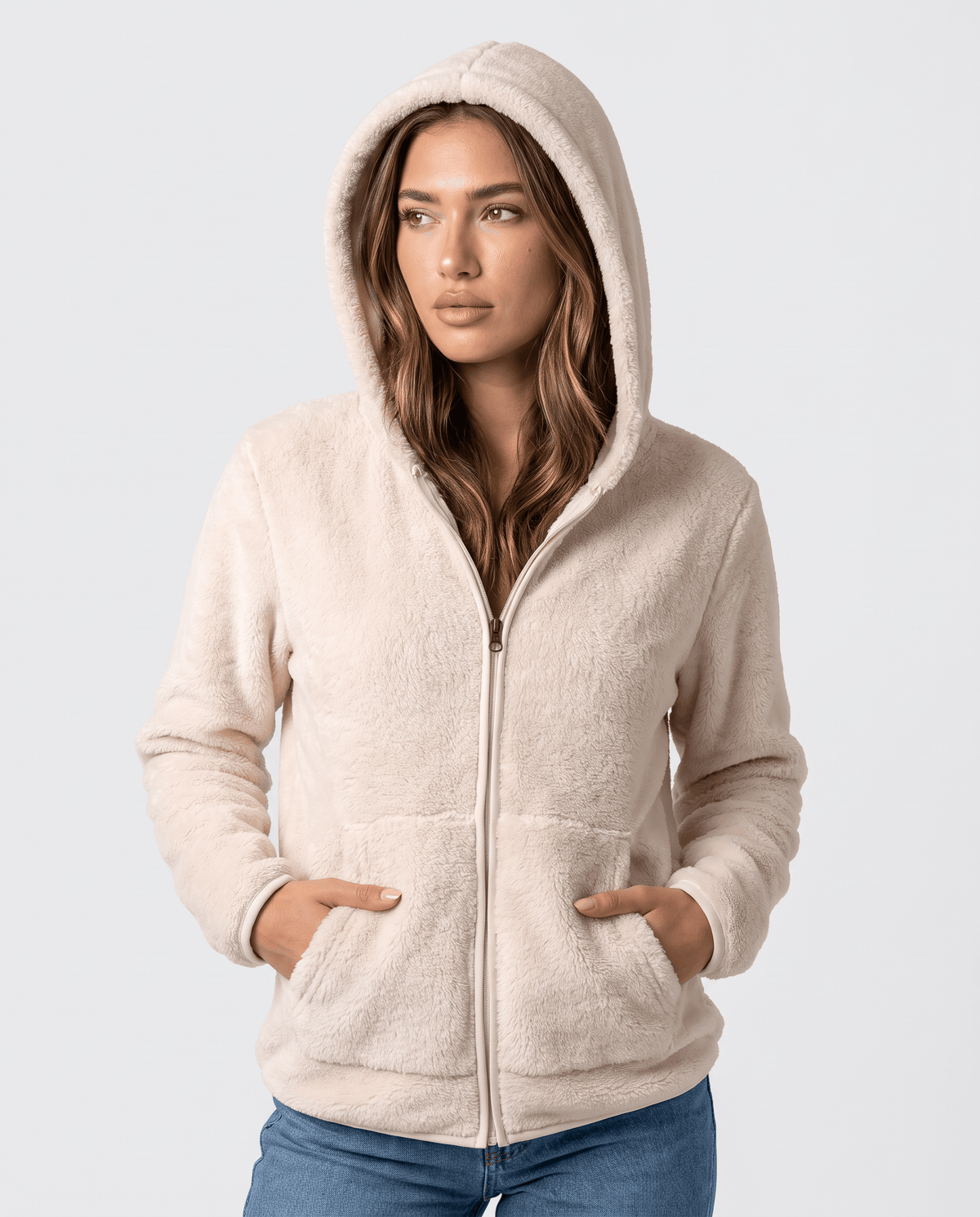 Front view of cream sherpa zip hoodie with the hood up and hands in pockets