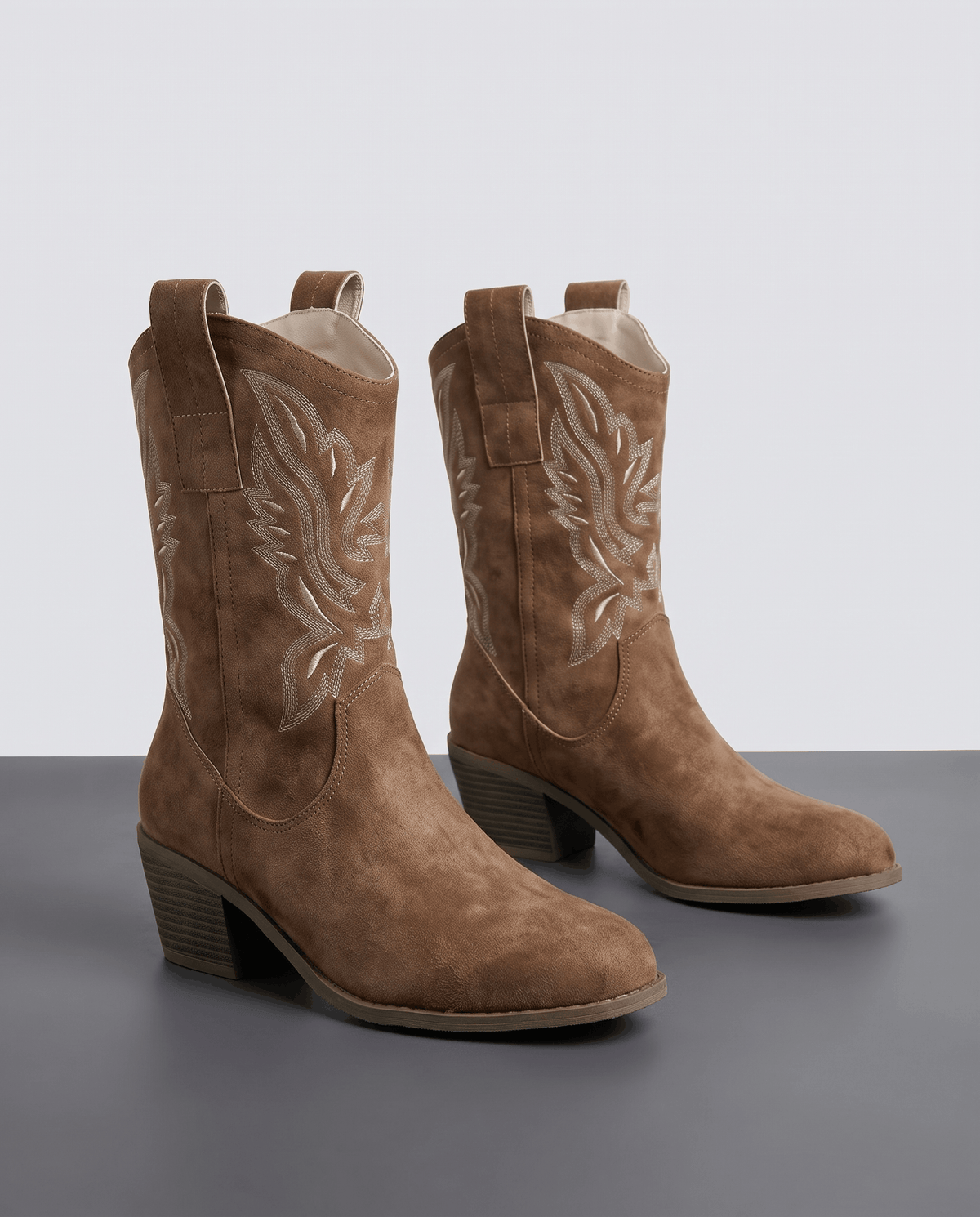 Pair of camel short cowboy boots with tonal embroidery, pointed toe and stacked heel