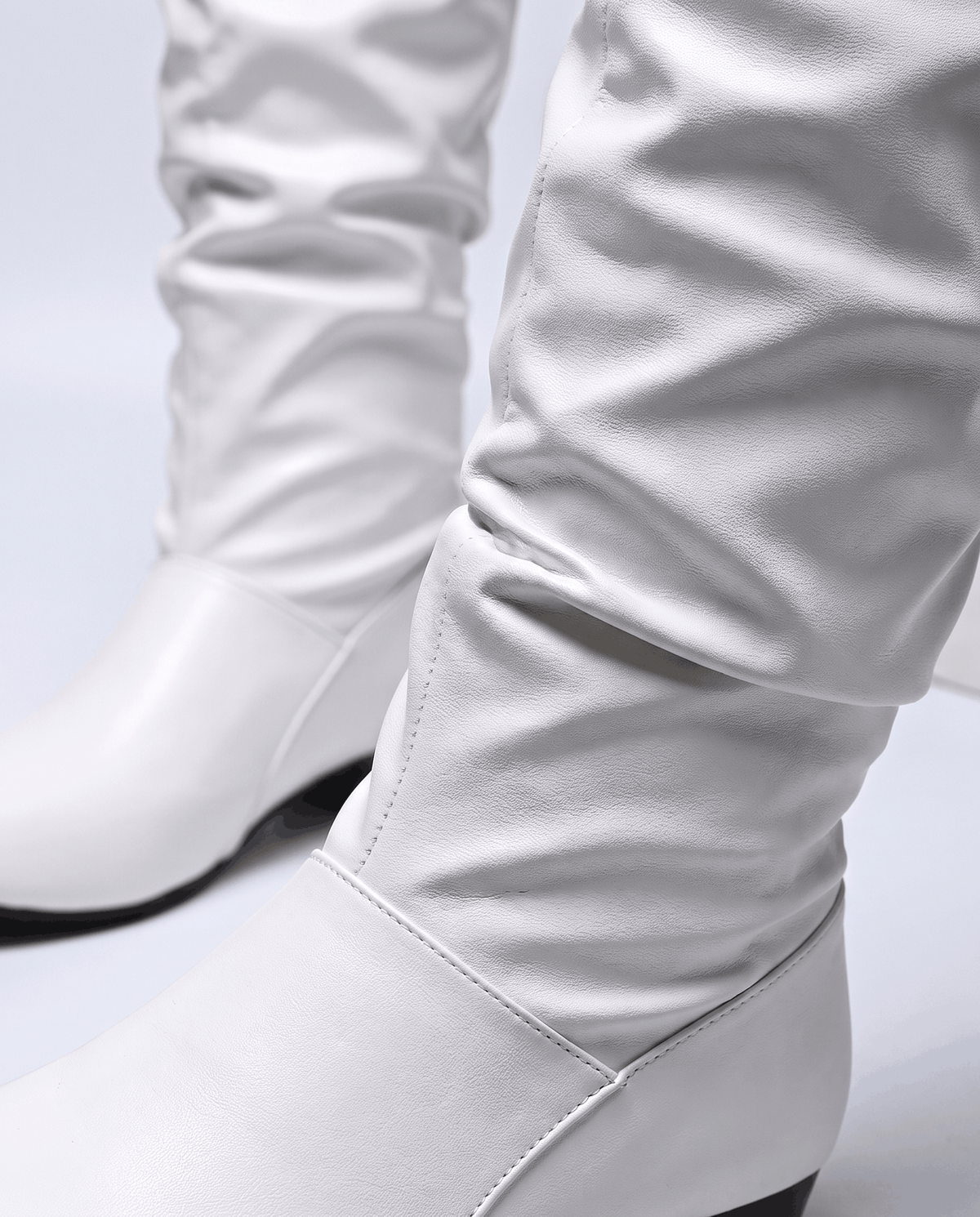 Close-up of the gathered white shaft and rounded toe