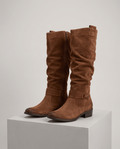 Slouchy knee-high riding boots in brown vegan suede on a white display block