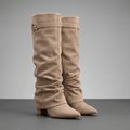 Taupe suede fold-over knee-high boots with a pointed toe, side zip, and low block heels.