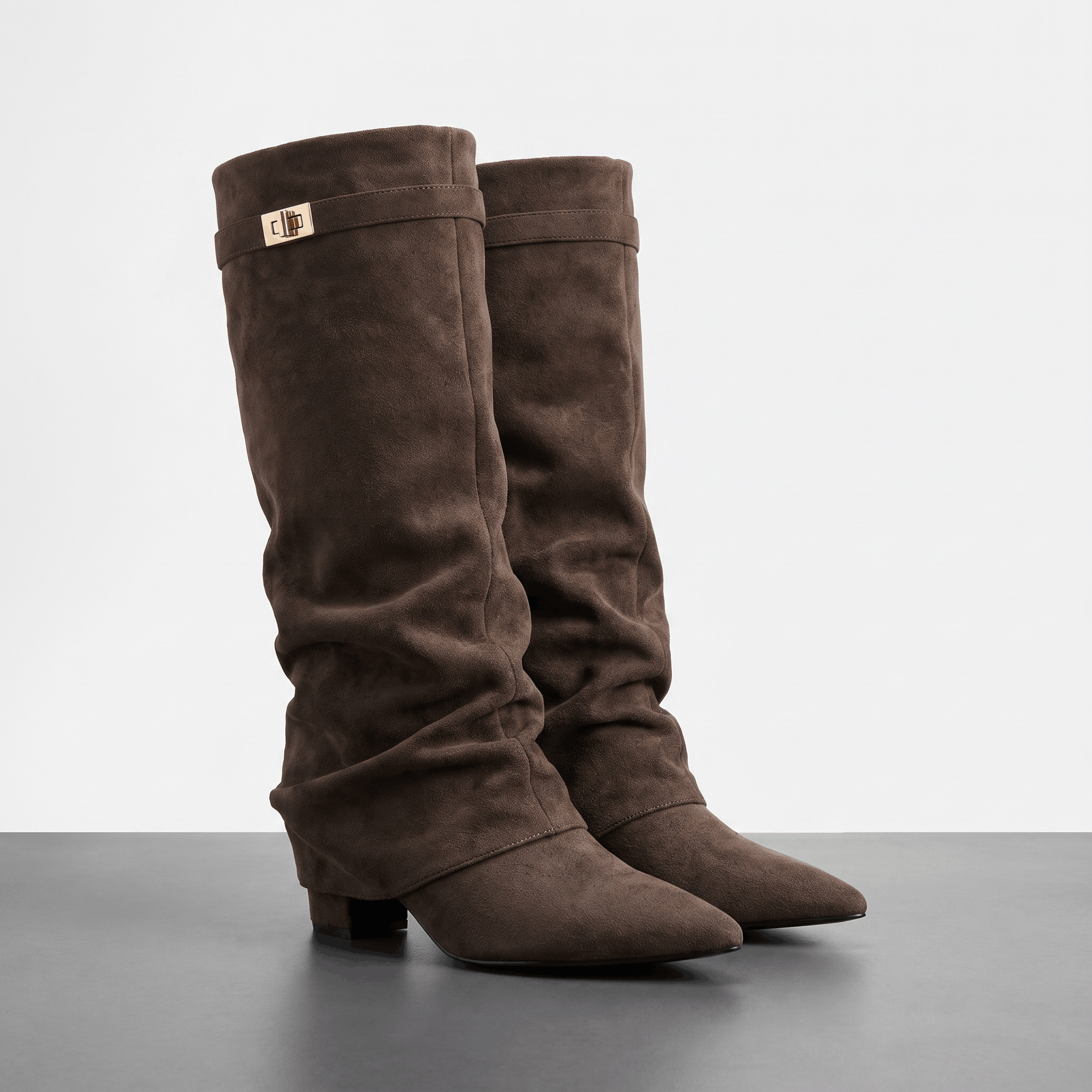 Dark brown suede fold-over knee-high boots with pointed toes and low block heels.