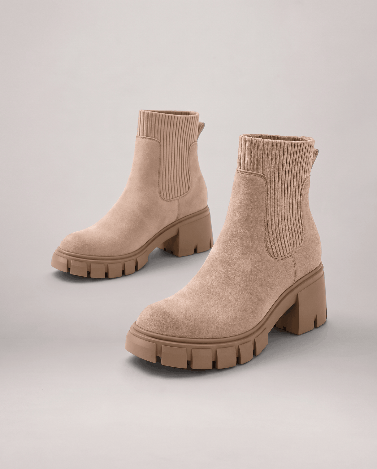 Apricot suede boots with ribbed side panels and a block heel
