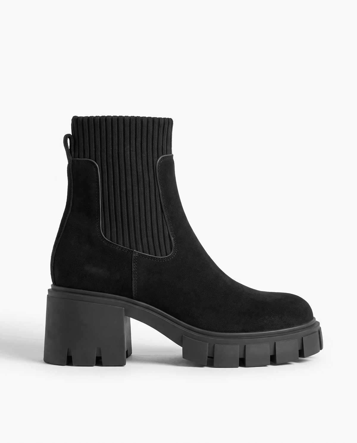 Side view of black suede boot with ribbed panel and block heel
