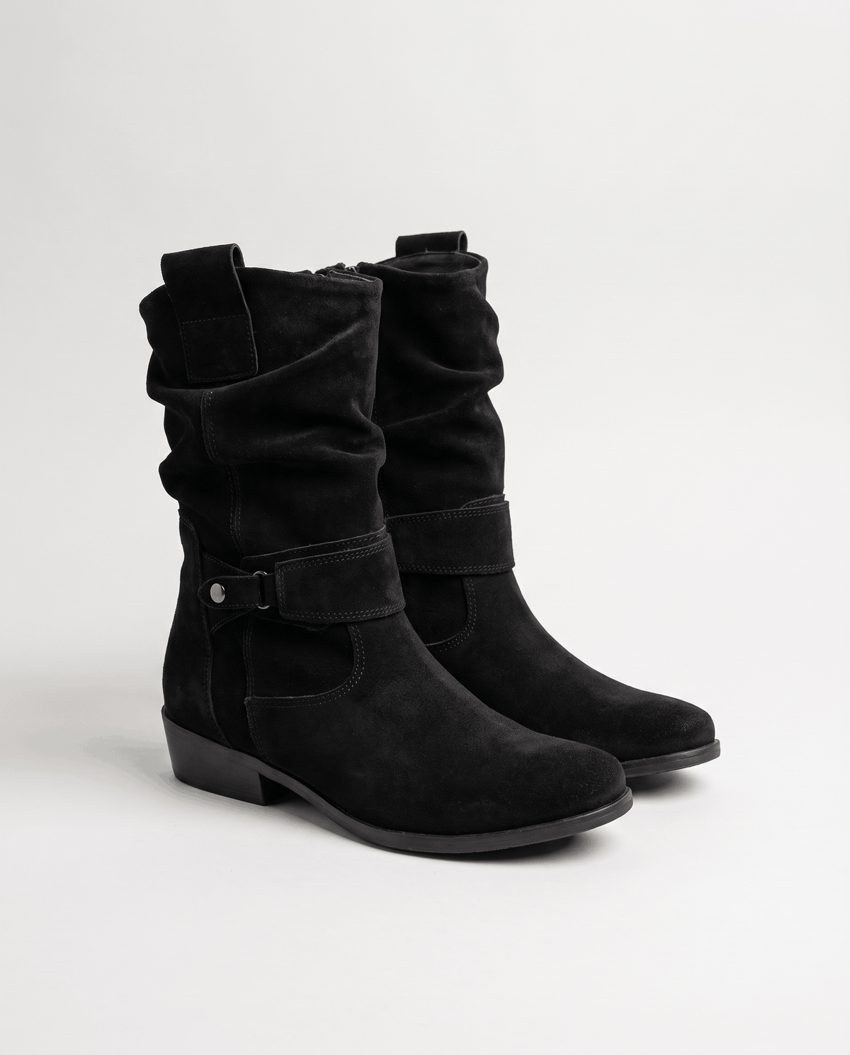 Pair of black suede slouch boots with a low block heel