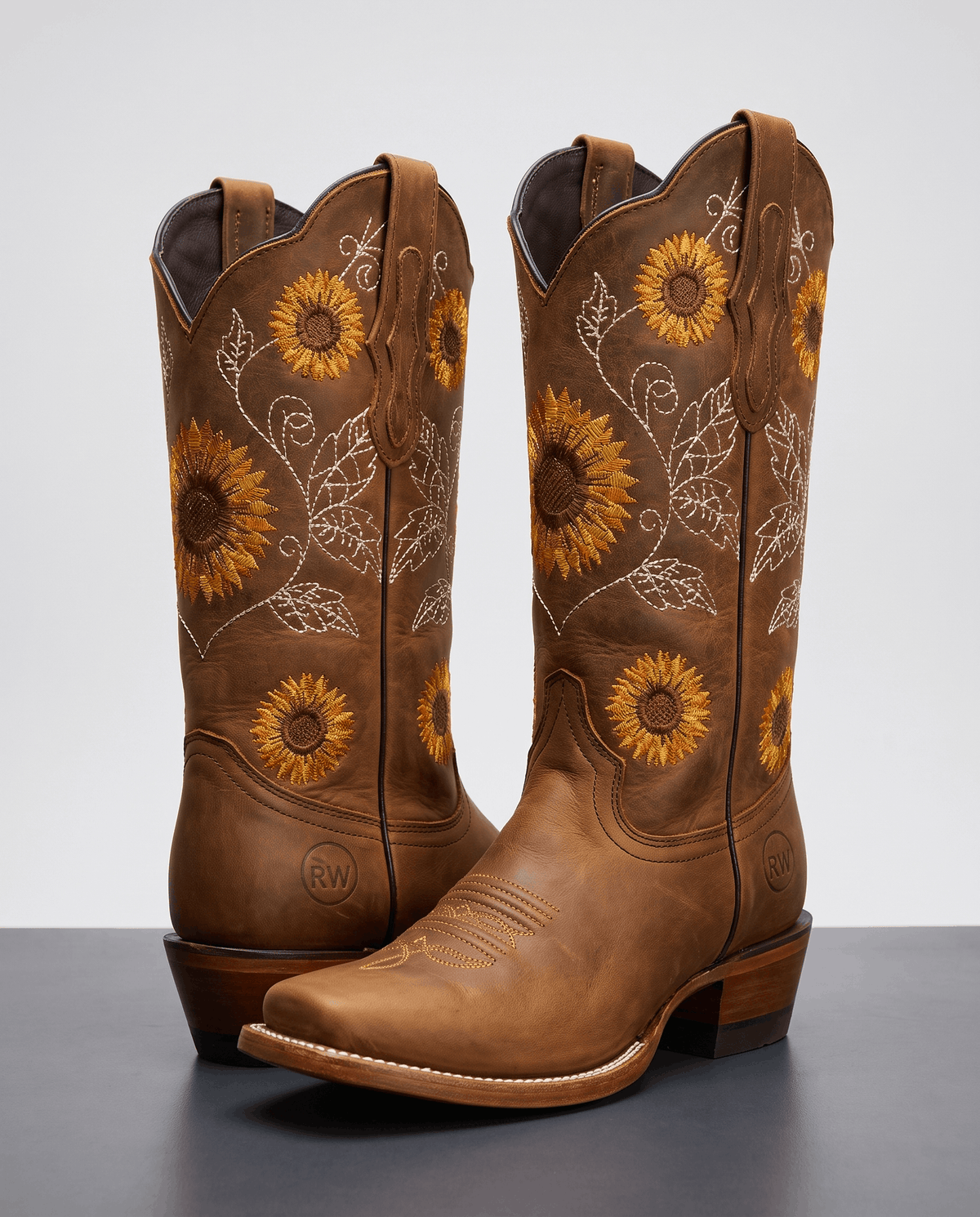 Sunflower embroidered cowboy boots in brown leather with a square toe and stacked heel