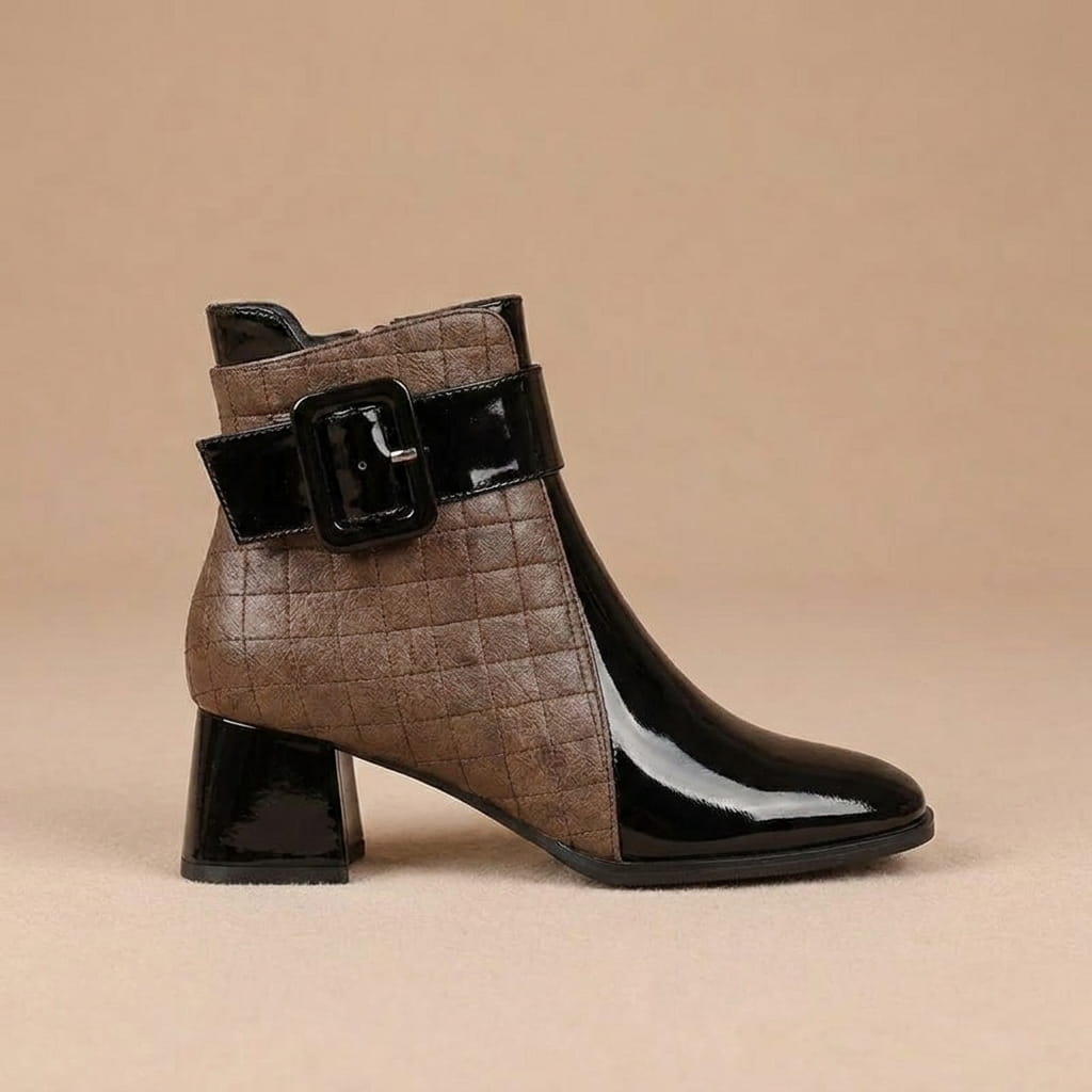 Brown croc-embossed vegan leather ankle boot with black side panels and a chunky block heel.