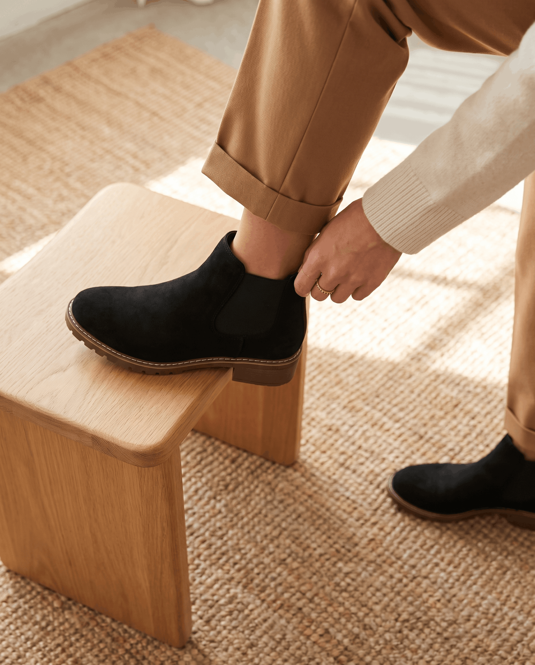 Black vegan suede Chelsea boots with elastic side panels, a stacked block heel, and a lug outsole on a stitched welt.