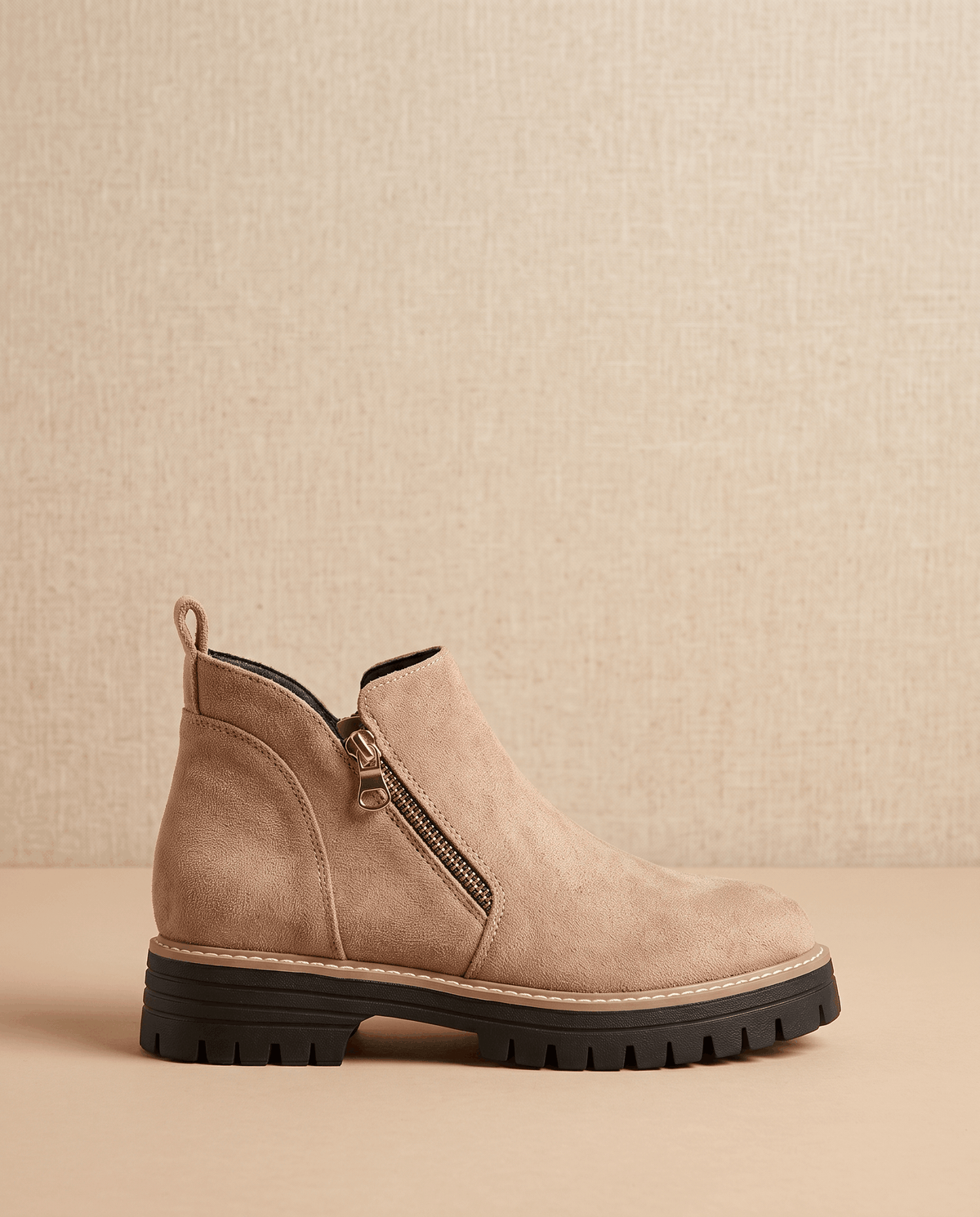Taupe vegan suede ankle boot with side zip, chunky lug platform, and cushioned wedge sole on a neutral background.