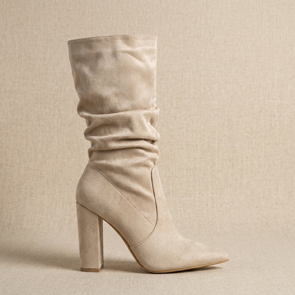 Beige vegan suede slouchy mid-calf boots displayed against a neutral background.